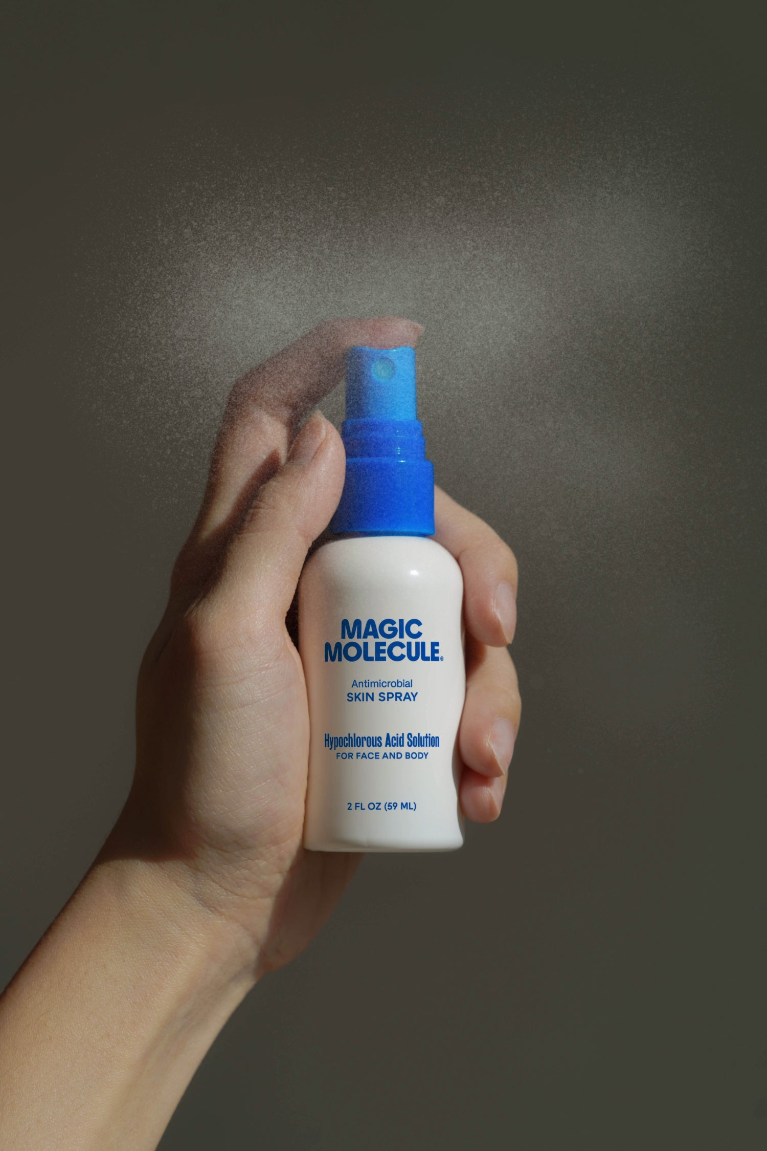 2oz spray being held 